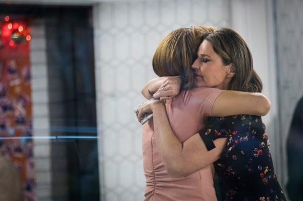 Hoda Kotb and Savannah Guthrie embrace at the end of the show on the set of NBC's Today Show, November 29, 2017 in New York City.
